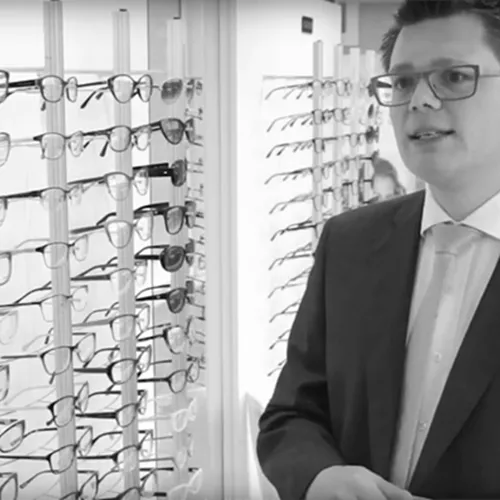 Male Hoya Vision optician in an opticians practice