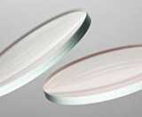 Image of two lenses on a grey background