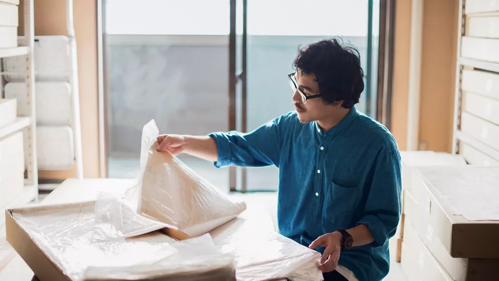 Architect wearing progressive lenses at a drafting table
