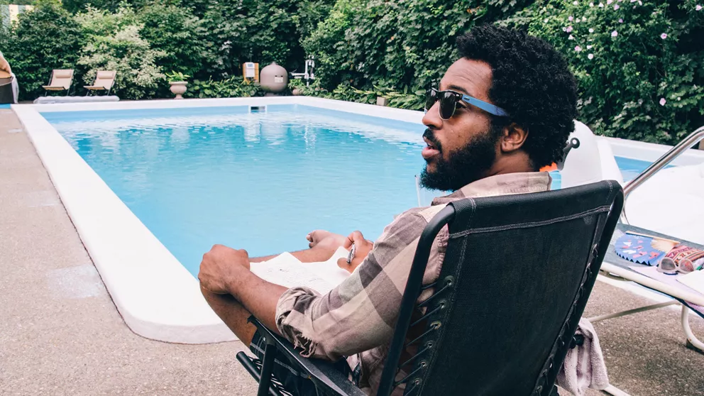 Man wearing HOYA polarized sunglasses at the pool