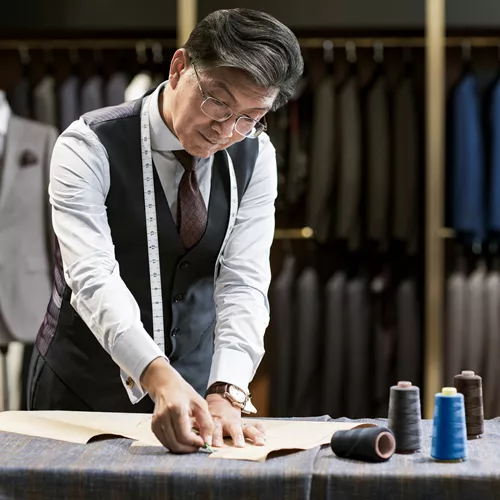 A tailor working with occupational lenses