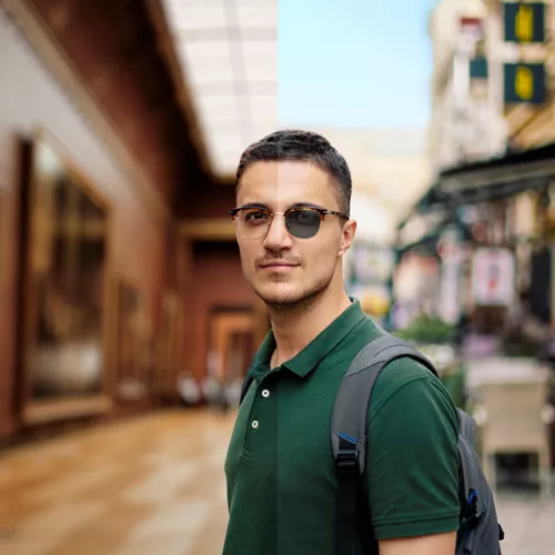 Man on holiday with light sensitive glasses