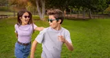 Boy and girl playing outside wearing HOYA MiYOSMART sunglasses