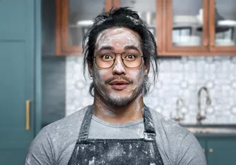 Surprised looking baker with flour in his face is wearing clean glasses with HOYA Hi-Vision Meiryo lenses
