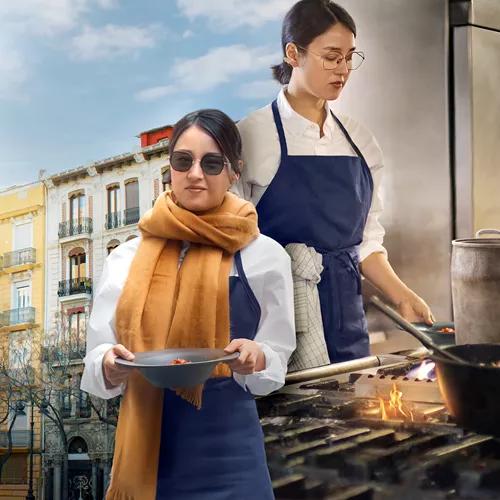 A cook wearing light sensitive HOYA Sensity lenses while working both indoors and outdoors