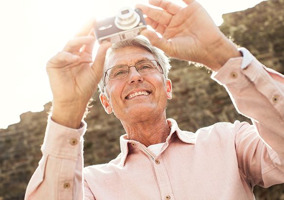 Hoya Vision a perfect fit by cutting edge technology old man taking photograph