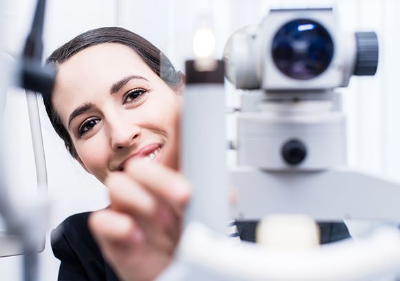 Hoya Vision independence commitment trust woman behind a machine