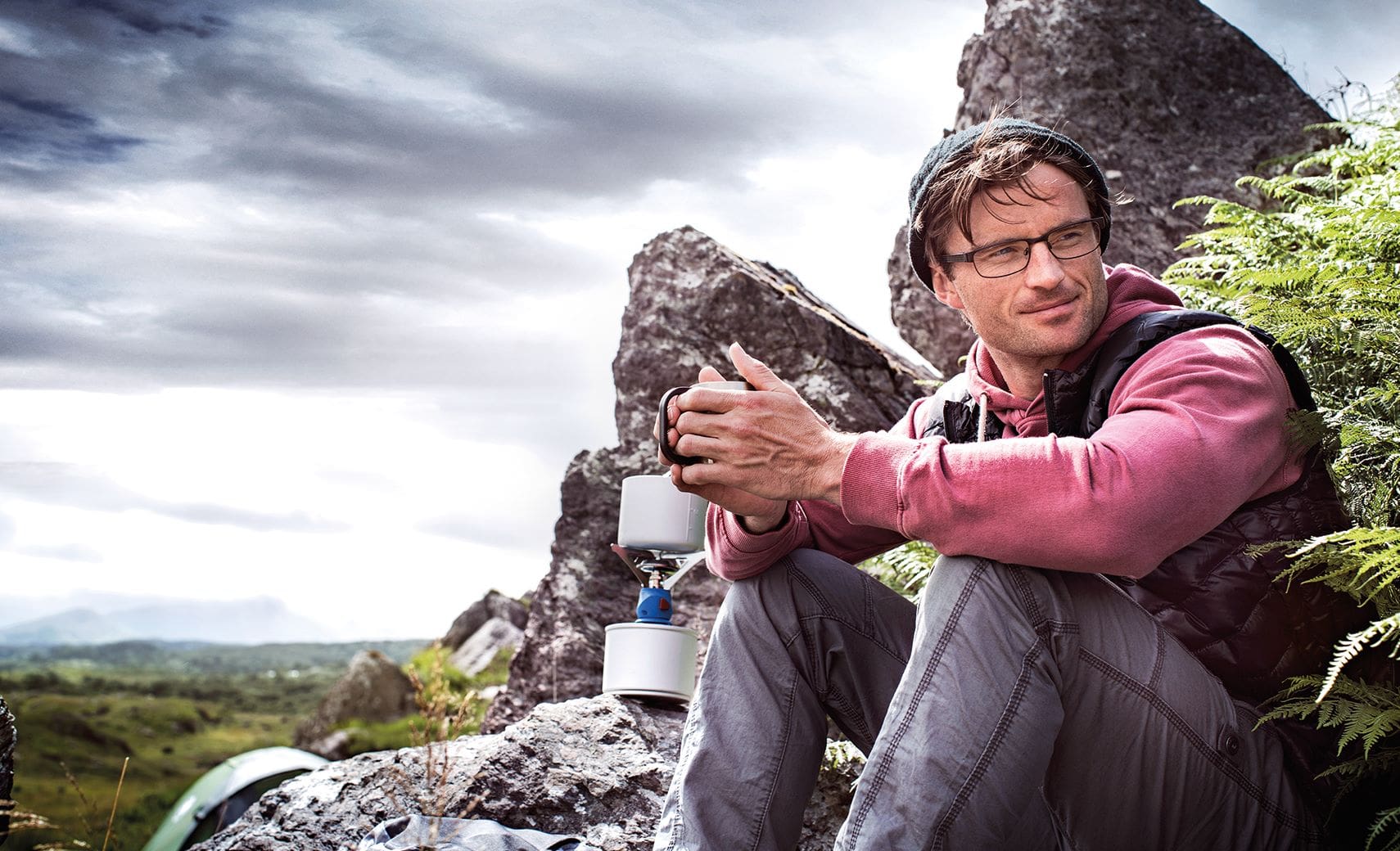 Male camping outdoors wearing Hoya Vision lenses