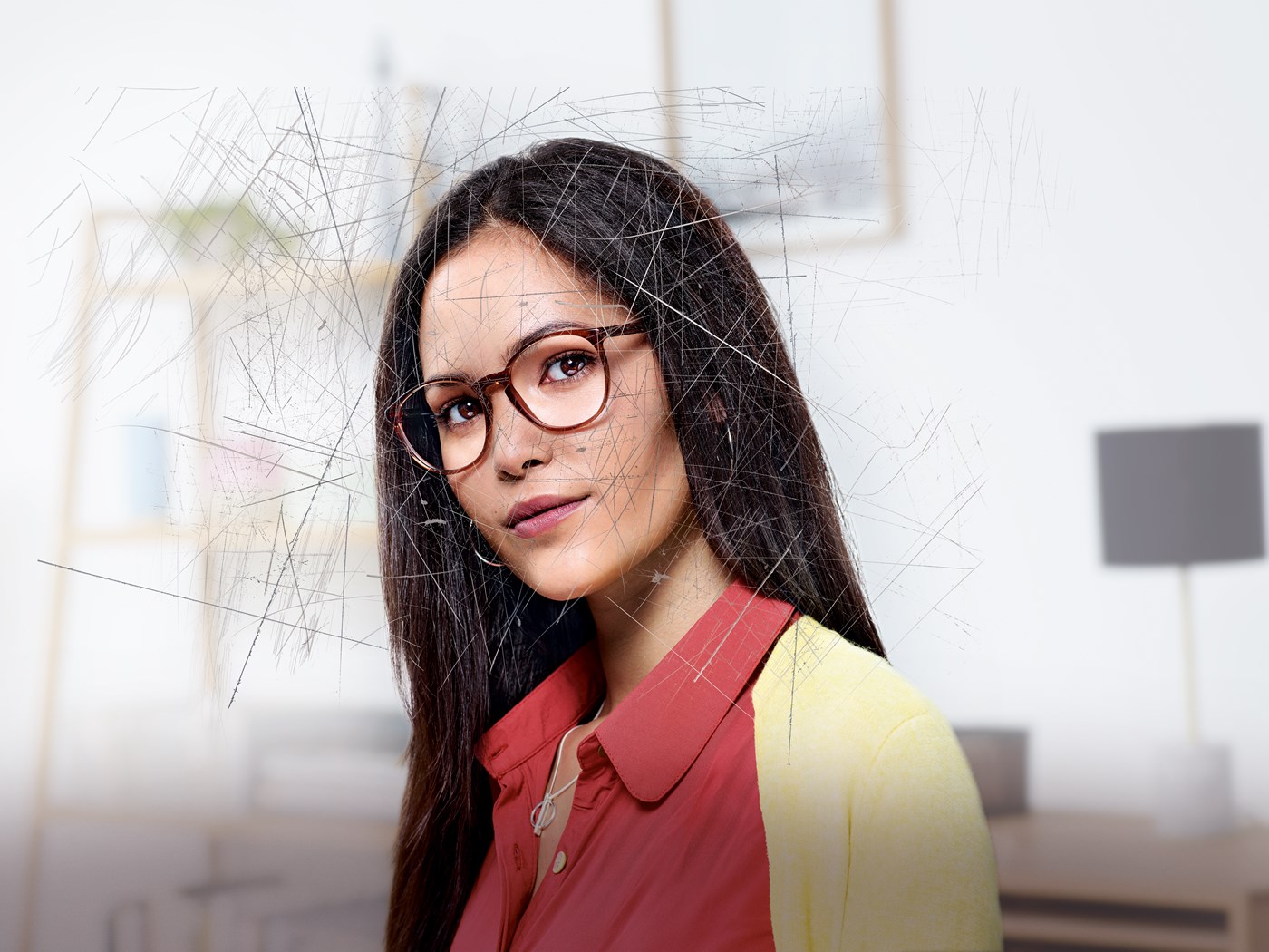 Woman wearing eyeglasses with Hoya Vision lenses behind a scratched screen