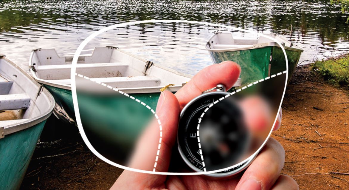 Image of three boats in river canal through a blurred lens
