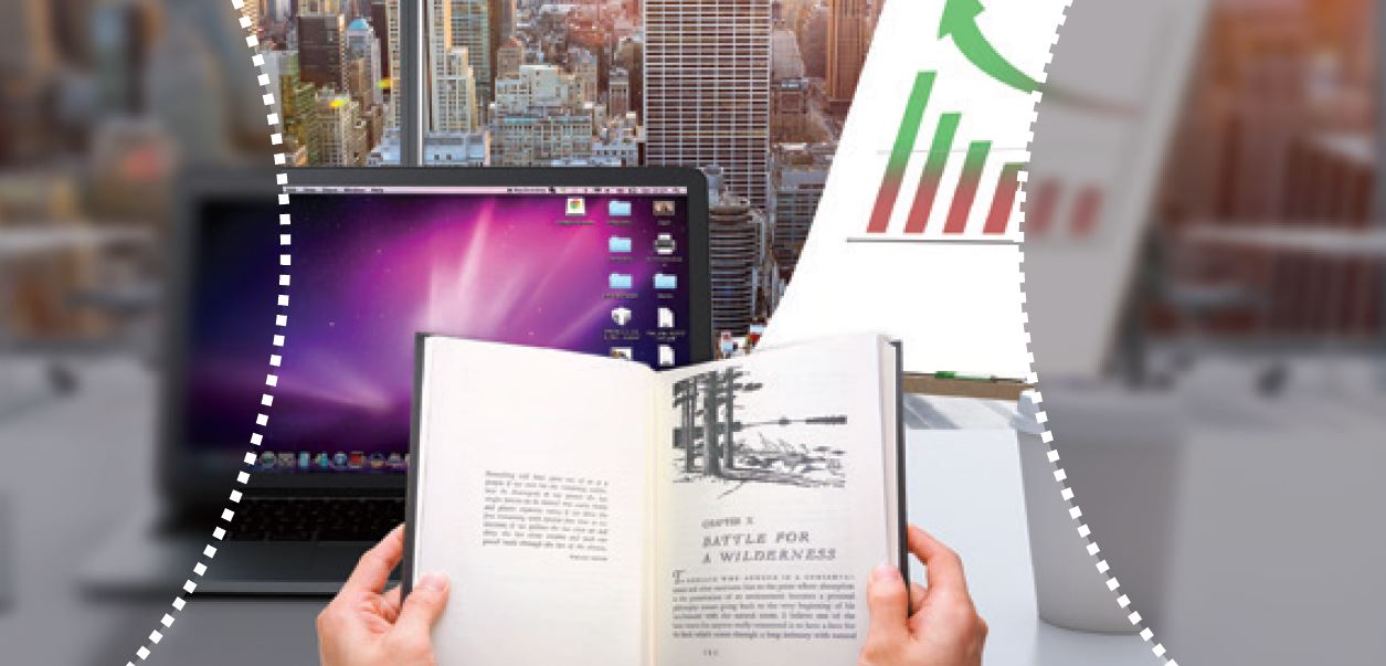 View of desk with book, laptop and coffee cup on desk