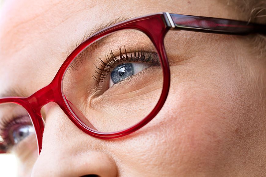 Close shot of woman wearing red frames