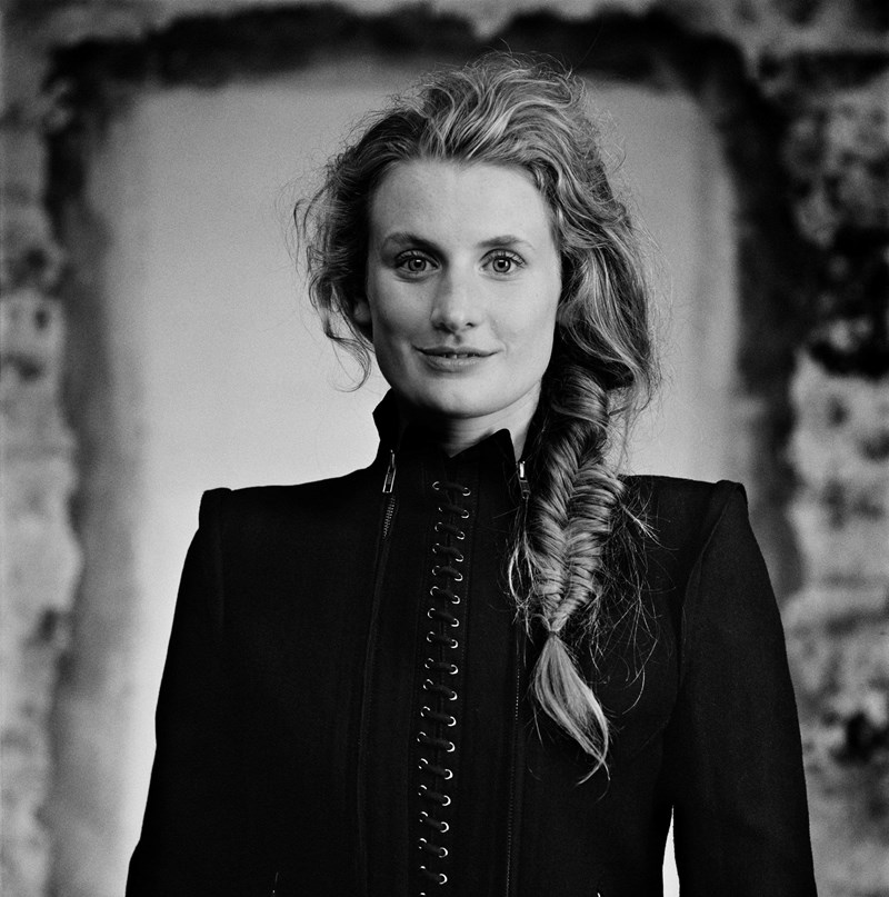 Black and white image of female looking at camera